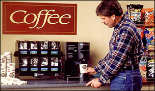 Photo of worker getting a cup of delicious coffee